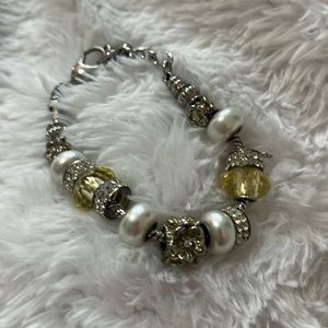 Silver bracelet with beads and lobster claw clasp.